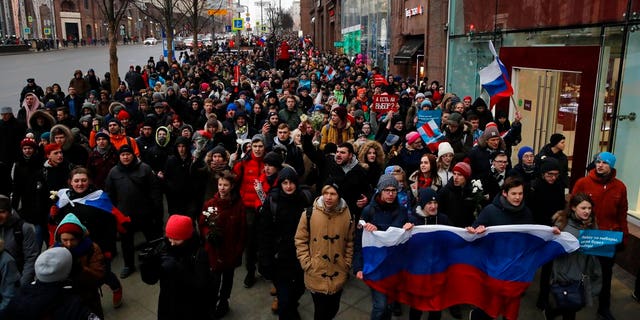 Protesters shout slogans during a rally in Moscow, Sunday, Jan. 28, 2018 against Russia's Central Election Commission's decision to ban the opposition leader Alexei Navalny presidential candidacy.