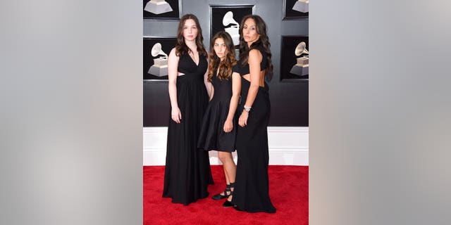 Lily Cornell, from left, and Toni Cornell, daughters of the late Chris Cornell, and Vicky Karayiannis, Cornell's widow, arrive at the 60th annual Grammy Awards at Madison Square Garden.