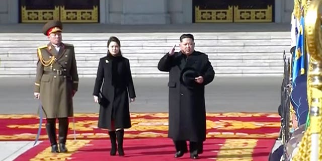 Kim Jong Un and his wife Ri Sol Ju walked the red carpet at the start of the parade.