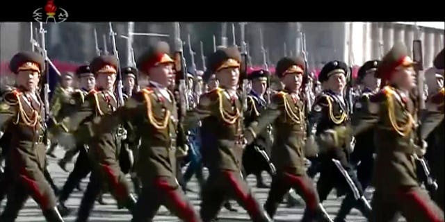 The goose-stepping troops marched through Kim Il Sung's square for the parade