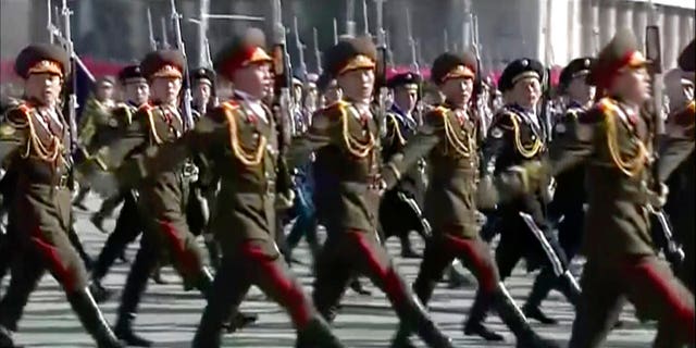 The goose-stepping troops marched through Kim Il Sung's square for the parade