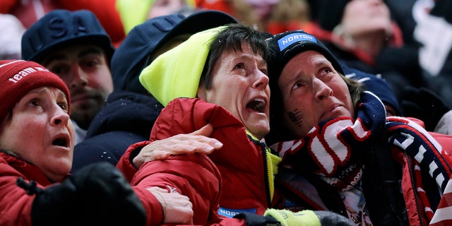 Sue Sweeney, center, the mother of Emily Sweeney of the United States, cries out as her daughter crashes on the final run during the women's luge final at the 2018 Winter Olympics in Pyeongchang, South Korea.