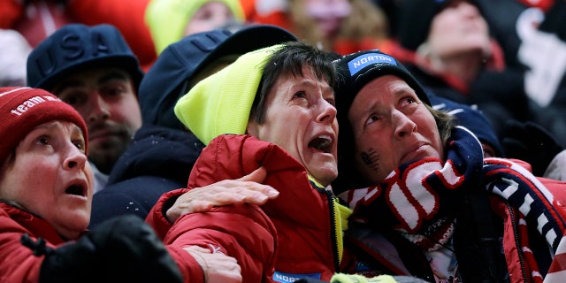 Sue Sweeney, center, the mother of Emily Sweeney of the United States, cries out as her daughter crashes on the final run during the women's luge final at the 2018 Winter Olympics in Pyeongchang, South Korea.