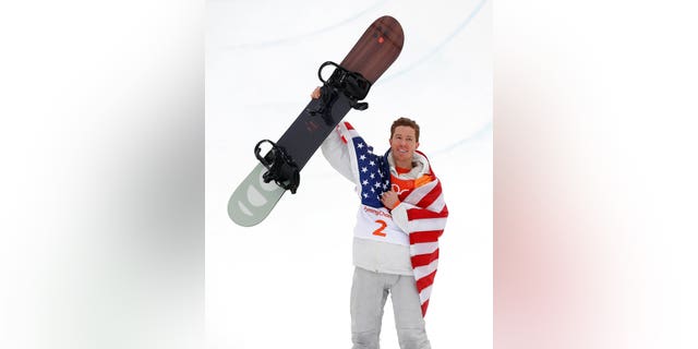 Gold medal winner Shaun White, of the United States, celebrates after the men's halfpipe finals at Phoenix Snow Park