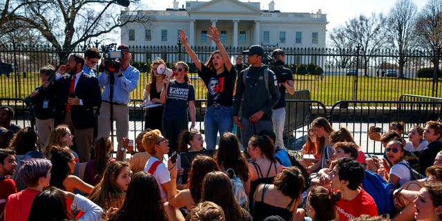 Demonstrators take part in a student protest for gun control legislation in front of the White House, Wednesday, Feb. 21, 2018, in Washington.