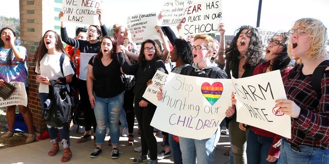 Millbrook High School students demonstrate against gun violence outside their school in Frederick County, Virginia, on Wednesday.