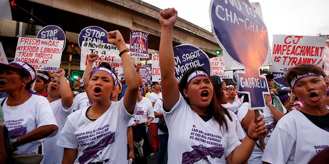 Hundreds of activists in pink and purple shirts protested in downtown Manila against Philippine President Rodrigo Duterte, calling him among the worst violators of women's rights in Asia.