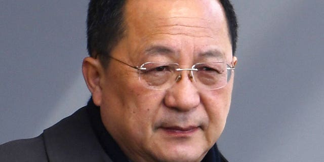 North Korean Foreign Minister Ri Yong Ho gets on a car on his arrival at the Beijing International airport in Beijing, Thursday, March 15, 2018. A Chinese Foreign Ministry spokesperson confirmed during a routine briefing that he was on his way to Sweden.