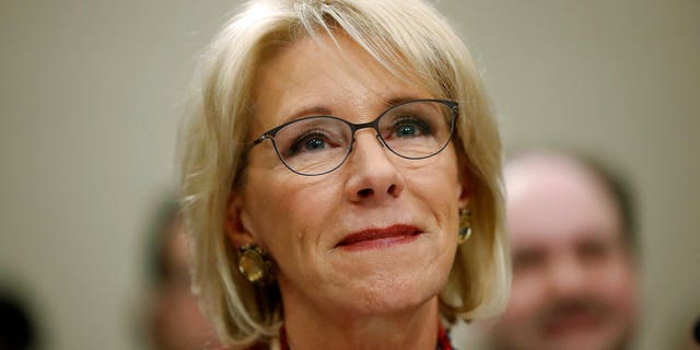 Education Secretary Betsy DeVos waits to testify before a House Committee on Appropriation subcommittee hearing on Capitol Hill in Washington.