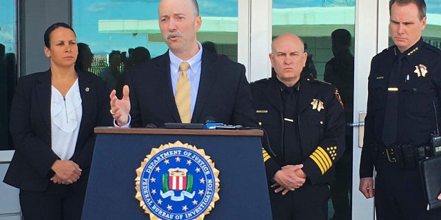 Sean Ragan, FBI special agent in charge, briefs reporters about a crash at the main gate of Travis Air Force Base, Calif., March 23, 2018.
