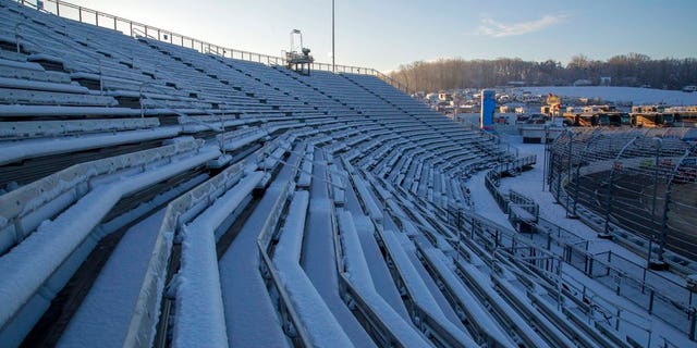 Snow covers seats at Martinsville Speedway in Martinsville, Va., Sunday, March 25, 2018. The NASCAR Cup Series race at Martinsville Speedway was postponed until Monday because of inclement weather. (AP Photo/Matt Bell)