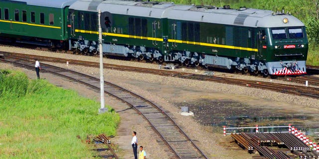 The green and yellow train was spotted at Beijing's central train station on Monday.