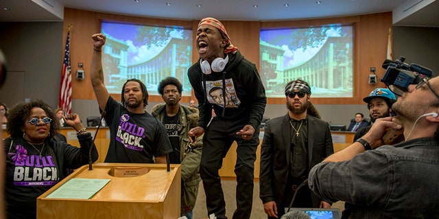 Stevante Clark, along with other demonstrators, attended the Sacramento City Council meeting Tuesday night, which opened with a moment of silence for his 22-year-old brother killed by police.
