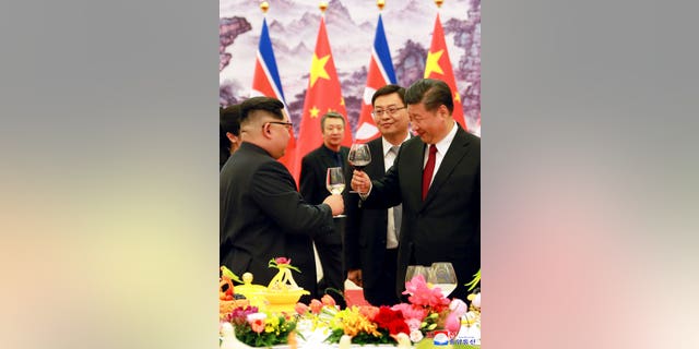 Xi Jinping and Kim Jong Un meet for the first time.  Relations between the two have improved since their first meeting in 2018. 