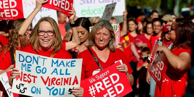 Arizona teachers and education advocates march at the state Capitol in March 2018.