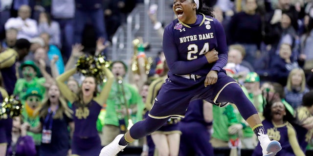 Notre Dame's Arike Ogunbowale celebrates after making the game-winning basket during overtime against Connecticut in the semifinals of the women's NCAA Final Four college basketball tournament, Friday, March 30, 2018, in Columbus, Ohio. Notre Dame won 91-89.