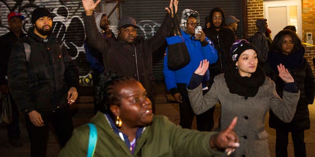 The slain suspect accosted numerous people before apparently threatening officers, surveillance footage shows.