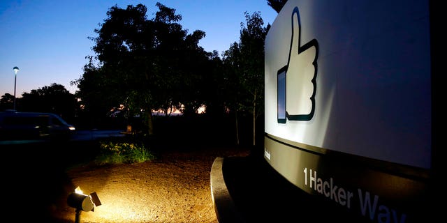 FILE - In this Jun 7, 2013, file photo, the Facebook "like" symbol is illuminated on a sign outside the company's headquarters in Menlo Park, Calif. (AP Photo/Marcio Jose Sanchez, File) (Copyright 2018 The Associated Press. All rights reserved.)