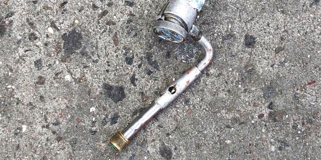 Police said the slain suspect pointed this pipe at officers in a threatening manner before being killed.