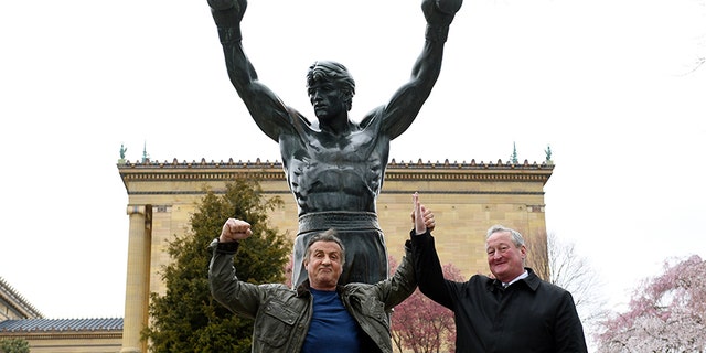 Sylvester Stallone, left, poses with Philadelphia Mayor Jim Kenney in front of the Rocky statue at the Philadelphia Art Museum on Friday.