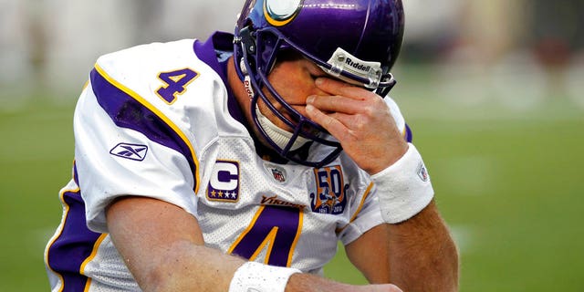 FILE 2010: Minnesota Vikings quarterback Brett Favre rubs his eyes after being hit by New England Patriots linebacker in Foxborough, Mass.