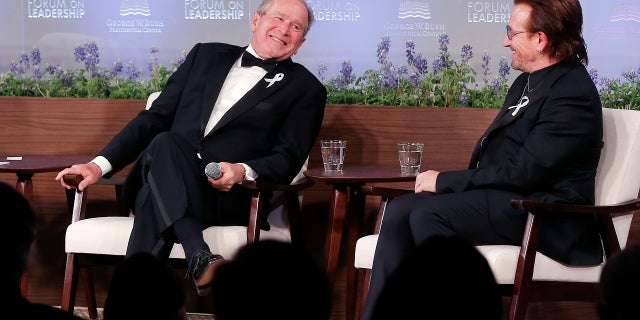 Former President George W. Bush, left, and U2 musician Bono participate in a Q&A session during a gala for the Forum on Leadership at the George W. Bush Institute, Thursday, April 19, 2018, in Dallas.