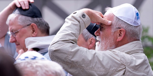 About 150 people — Jews, Muslims, Christians and atheists — came together Wednesday and put on kippas in a show of solidarity in the eastern city of Erfurt.