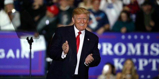 U.S. President Donald Trump arrives at a campaign rally in Washington Township, Mich., Saturday, April 28, 2018. (AP Photo/Paul Sancya)