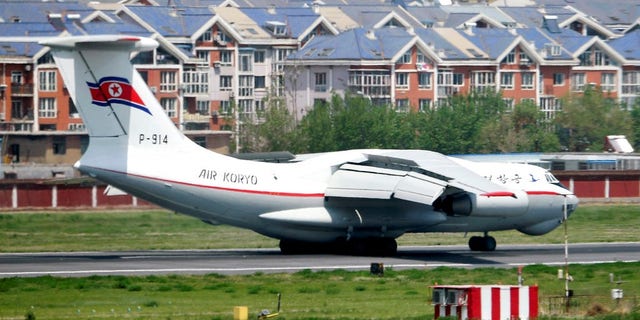 A North Korea's Air Koryo plane lands in an airport in Dalian, China, Tuesday, May 8, 2018.