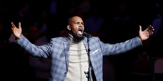 R. Kelly performs the national anthem at an NBA game in Brooklyn, N.Y., Nov. 17, 2015.