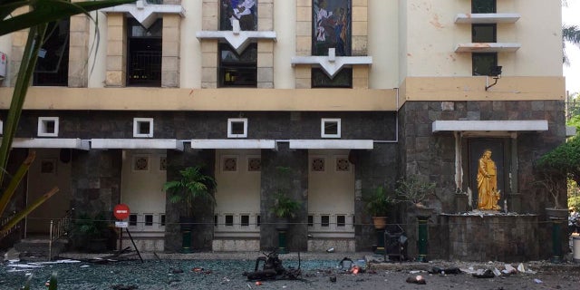 Debris are seen outside Santa Maria church where an explosion went off in Surabaya, East Java, Indonesia, May 13, 2018.