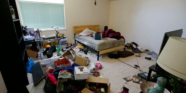Toys and other items are strewn around one of the bedrooms of a home in Fairfield, California. Ten children were removed from the home in March.