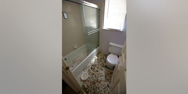 The bathroom is strewn with feces at a home in Fairfield, Calif., Monday, May 14, 2018, where authorities removed 10 children and charged their father with torture and their mother with neglect after an investigation revealed a lengthy period of severe physical and emotional abuse.