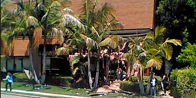 This image taken from cellphone video shows a building after a fatal explosion in Aliso Viejo, California on Tuesday, May 15, 2018.