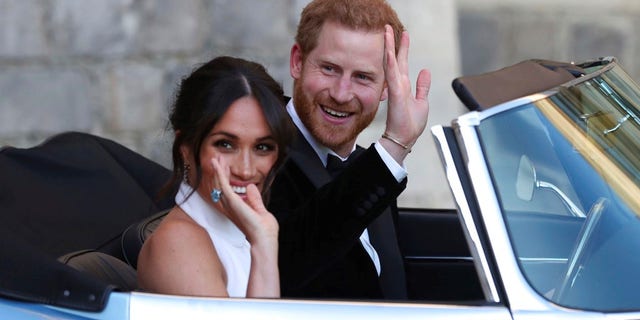 Prince Harry and Meghan Markle leave for the reception hosted by Prince Charles.