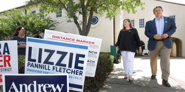 Lizzie Pannill Fletcher, a Democrat candidate for the 7th Congressional District, and her husband, Scott Fletcher, leave after voting in the primary runoff at St. Anne's Church, Tuesday, May 22, 2018, in Houston.