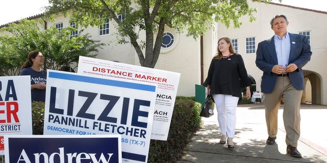 Lizzie Pannill Fletcher, a Democrat candidate for the 7th Congressional District, and her husband, Scott Fletcher, leave after voting in the primary runoff at St. Anne's Church, Tuesday, May 22, 2018, in Houston.