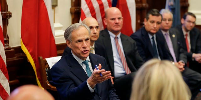 Texas Gov. Greg Abbott, center, hosted a roundtable discussion in Austin, Texas, Thursday, May 24, 2018, to address safety and security at Texas schools in the wake of the shooting at Santa Fe, Texas last week.