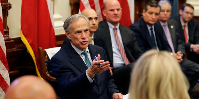 Texas Gov. Greg Abbott, center, hosted a roundtable discussion in Austin, Texas, Thursday, May 24, 2018, to address safety and security at Texas schools in the wake of the shooting at Santa Fe, Texas last week.