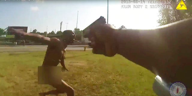 This still image taken from the Richmond, Va., Police body camera shows a police officer pointing his gun at Marcus-David Peters on May 14, 2018, in Richmond, Va.