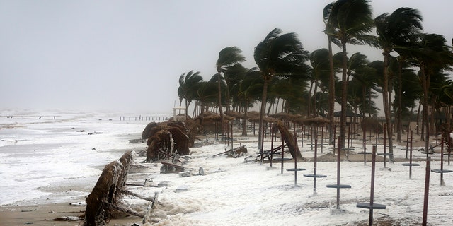 Strong waves and wind pound a beach after Cyclone Mekunu in Salalah, Oman.