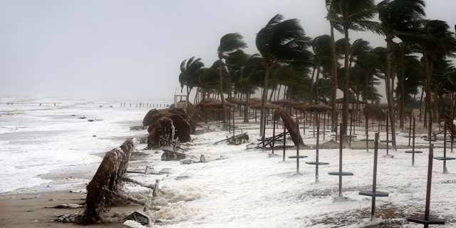 Strong waves and wind pound a beach after Cyclone Mekunu in Salalah, Oman.