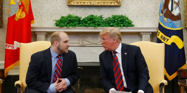 President Donald Trump talked with Joshua Holt, who was recently released from a prison in Venezuela, in the Oval Office.