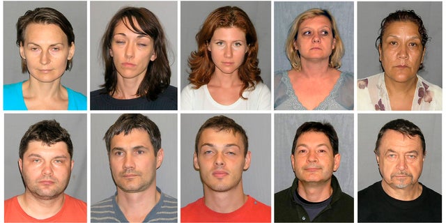 This file photo combo of 10 undated booking photos, provided by U.S. Marshals, includes Tracey Ann Foley, top row second from right, whose real name is Elena Vavilova, after the FBI arrested her and nine others in 2010 for being Russian spies. Also pictured are: from top left, Cynthia Murphy whose real name is Lydia Guryev, Patricia Mills whose real name is Natalia Pereverzeva, Anna Chapman, Vavilova, Vicky Pelaez. Bottom row from left: Richard Murphy born Vladimir Guryev, Michael Zottoli whose real name is Mikhail Kutsik, Mikhail Semenko, Donald Howard Heathfield whose real name is Andrey Bezrukov and Juan Lazaro whose real name is Mikhail Vasenkov.