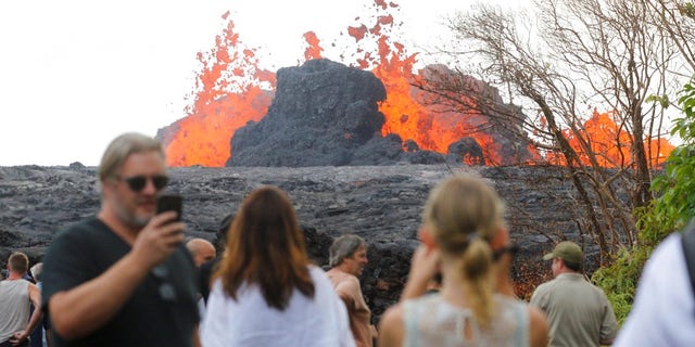 Residents, the media and national guard flock to what is now the end of Leilani Avenue to take in the fiery show at fissures 2, 7 and 8 of the Kilauea volcano near Pahoa.