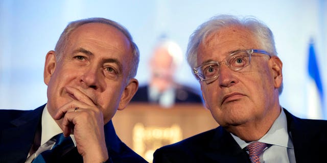 Israeli Prime Minister Benjamin Netanyahu, left and David Friedman, right, the new U.S. ambassador to Israel, attend a ceremony celebrating the 50th anniversary of the liberation and unification of Jerusalem, in front of the walls of the Old City of Jerusalem, May 21, 2017.
