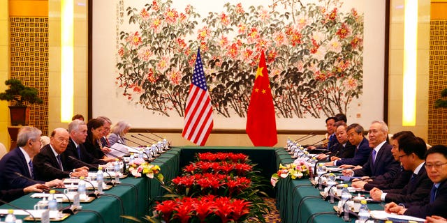 U.S. Commerce Secretary Ross, second from left, is in Beijing for trade talks after Washington ratcheted up tensions with a new threat of tariff hikes on Chinese high-tech exports.