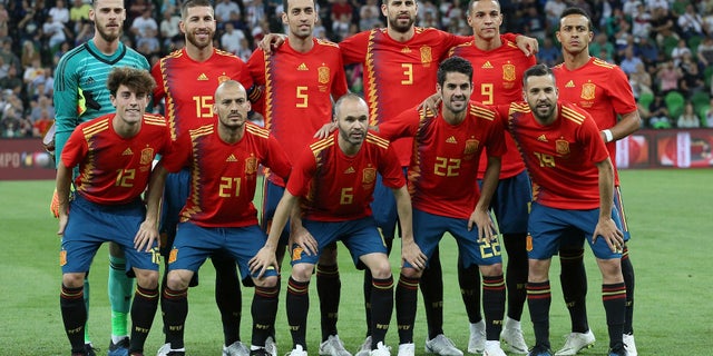 Spain’s jersey forgoes symmetry for a row of yellow and purple triangles down the side of the red kit.