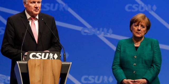 Difference of opinion: Horst Seehofer (left) wants Germany to turn back refugees who have already registered in other countries, a sharp contrast to Merkel’s open door policy