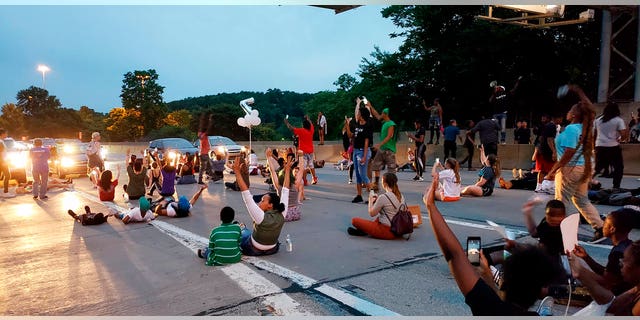 People protesting the East Pittsburgh police after the June 19 shooting death of Antwon Rose shut down Interstate 376 in Pittsburgh on Thursday